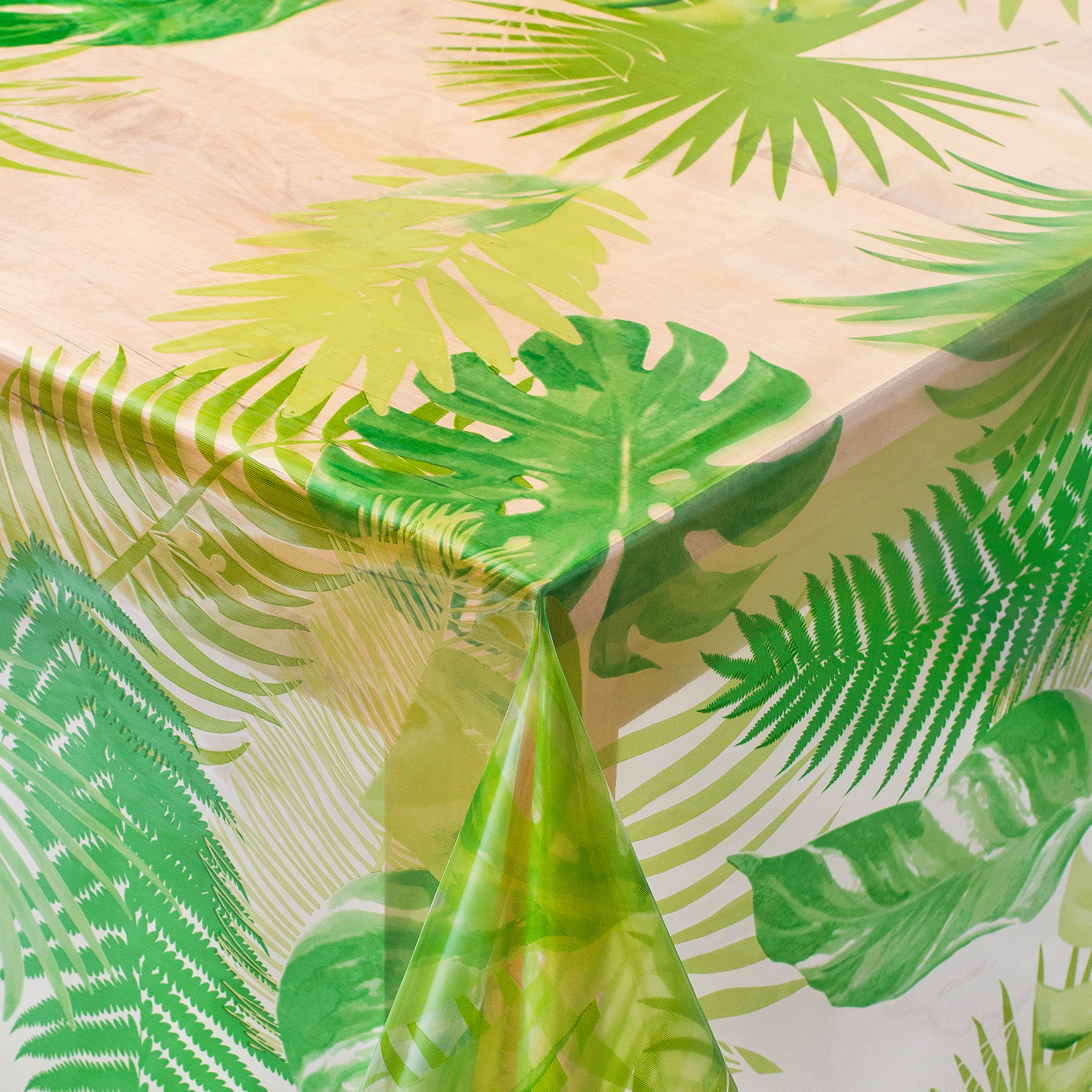 Klar voksdug med grønne palmeblade a